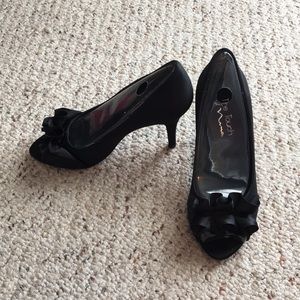 Black heals with ruffle.